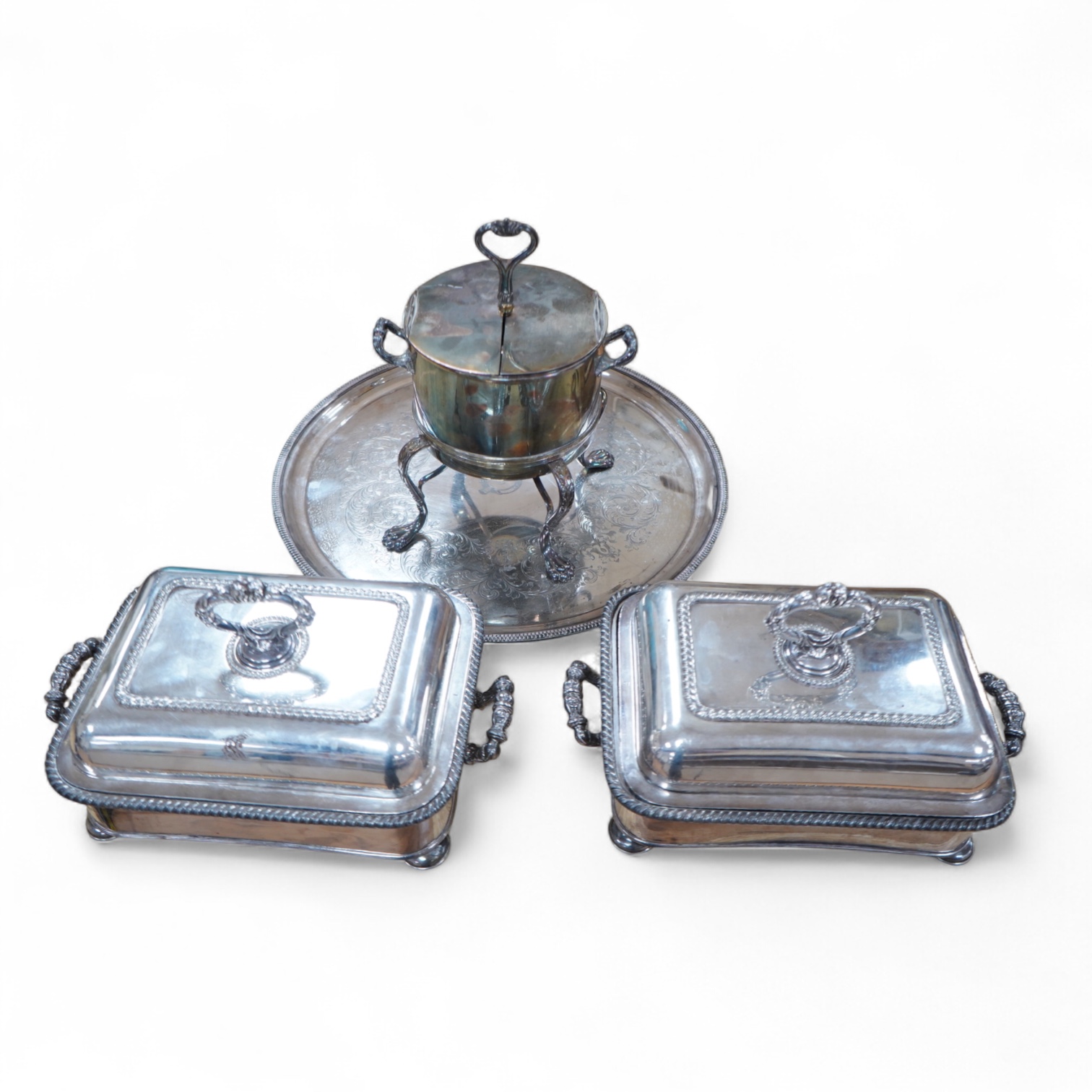 A pair of silver plated entrée dishes, an egg coddler and salver
